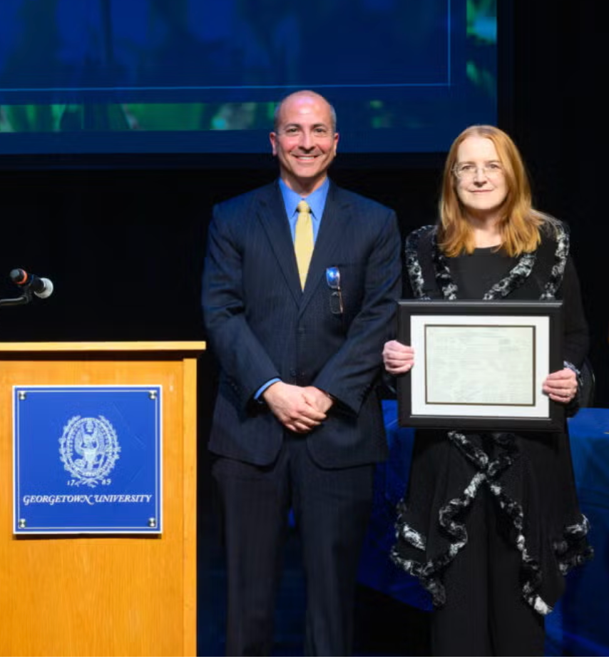 Professor Alison Mackey holding the Conde Nast Award